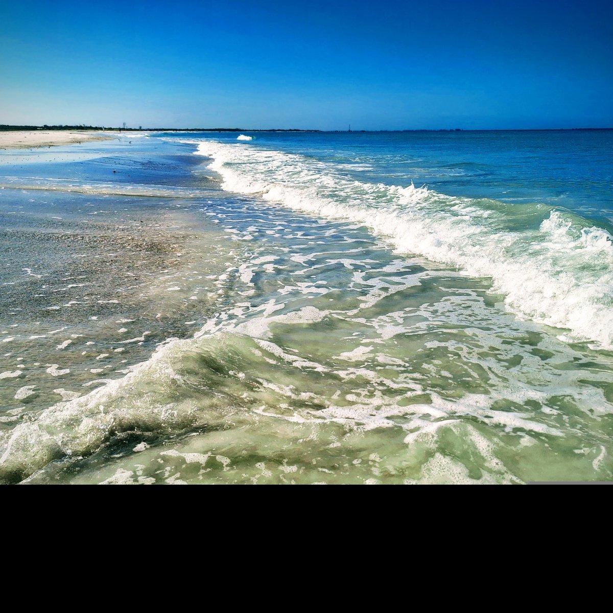 Clear Blue Ocean Waves Reflection.jpg