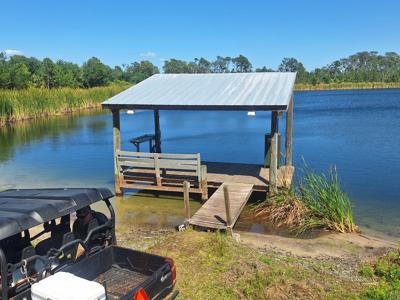 Serene Lake Dock Sunny Day Reflection.jpg