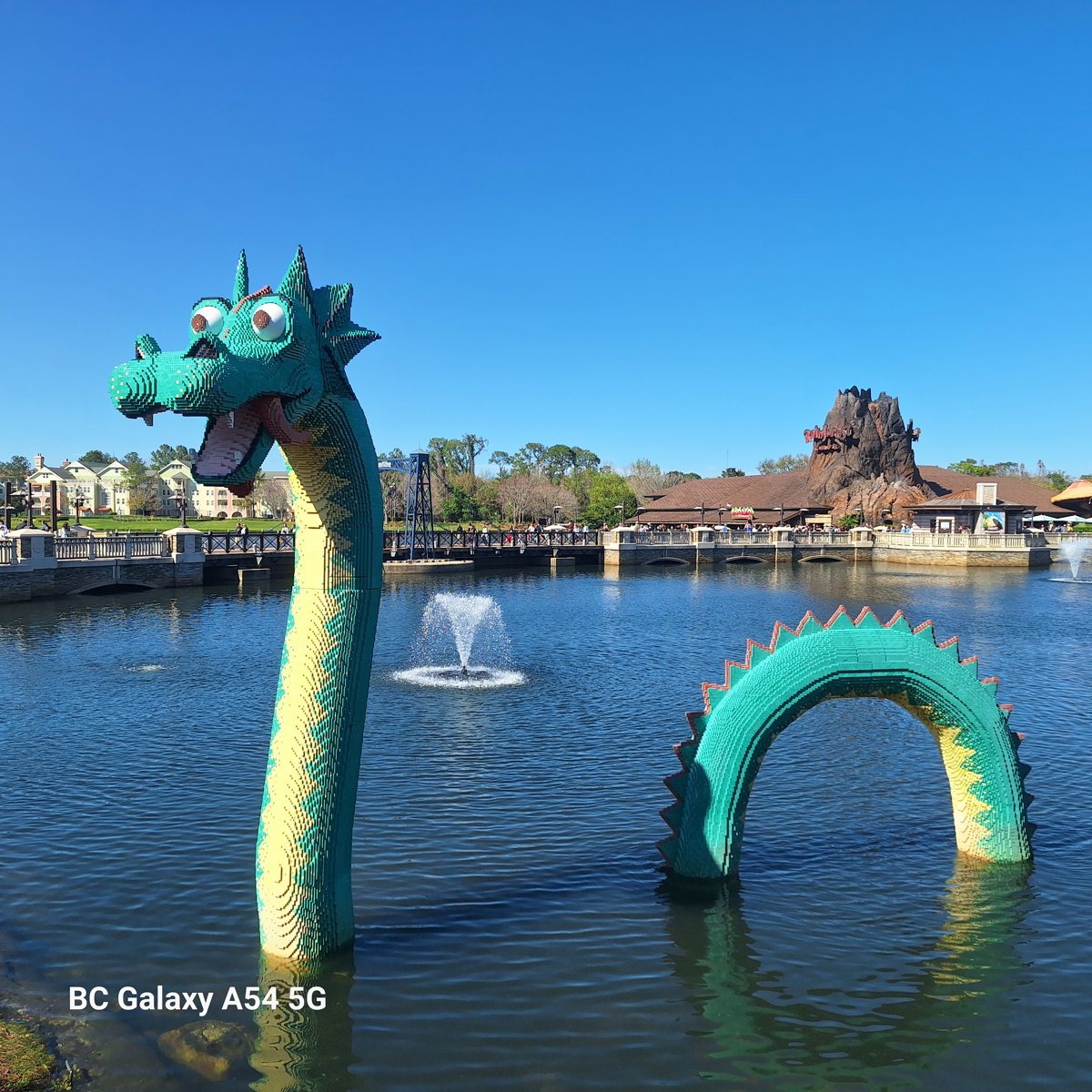 Vibrant Calm Lake Dragon Sculpture Serenity Moment.jpg