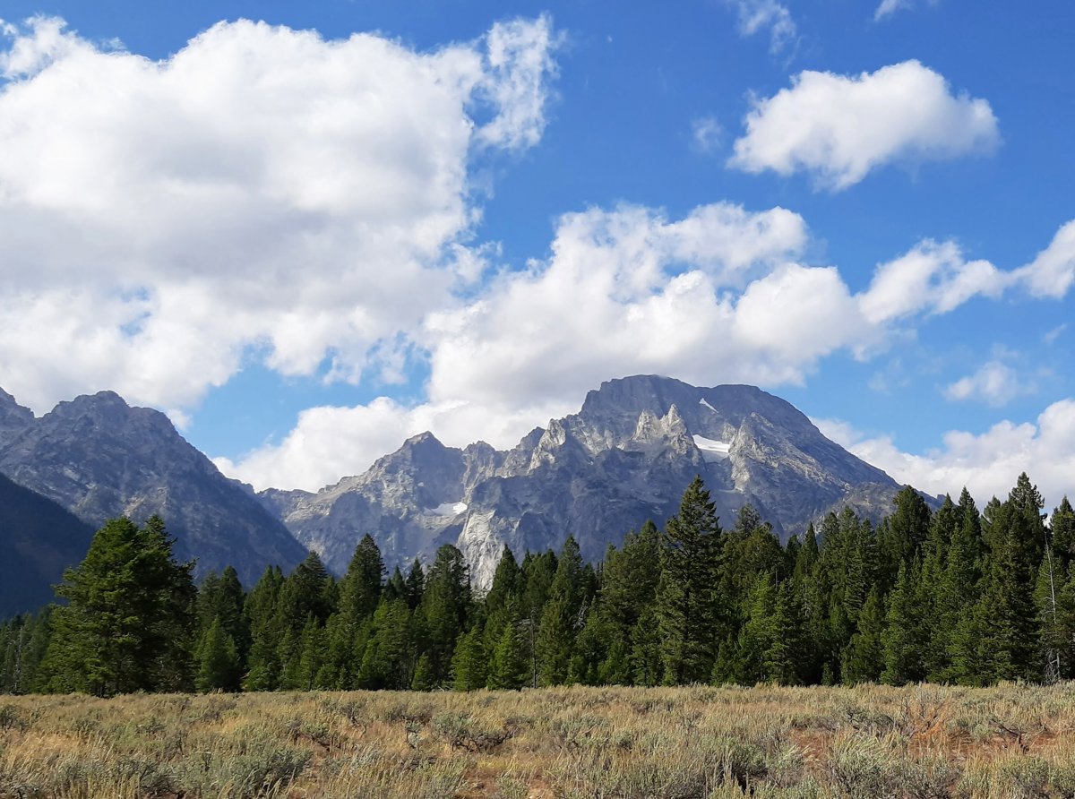 Majestic Mountain Range Under Blue Skies Moment.jpg