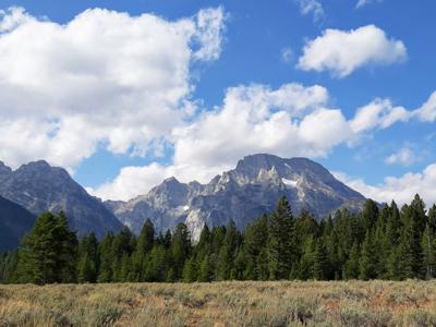 Majestic Mountain Range Under Blue Skies Moment.jpg