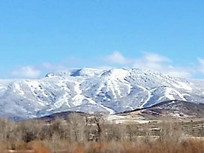 Snow-capped Mountains Against Clear Blue Sky Scene.jpg