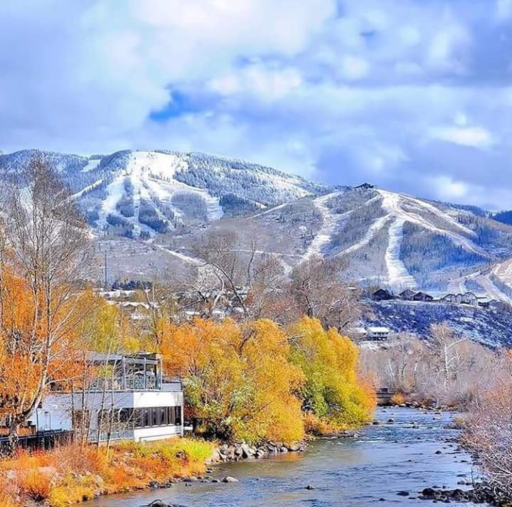 Vibrant Autumn River Mountainscape Scene.jpg