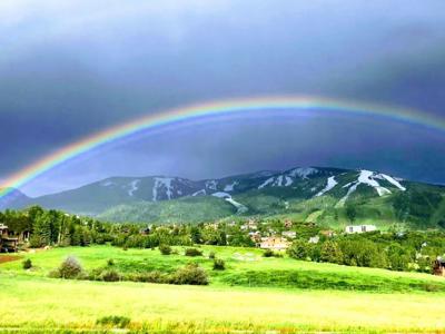 Vibrant Rainbow Over Mountain Valley Capture.jpg