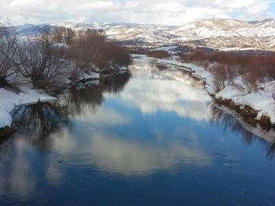 Serene Winter River Reflections Capture.jpg