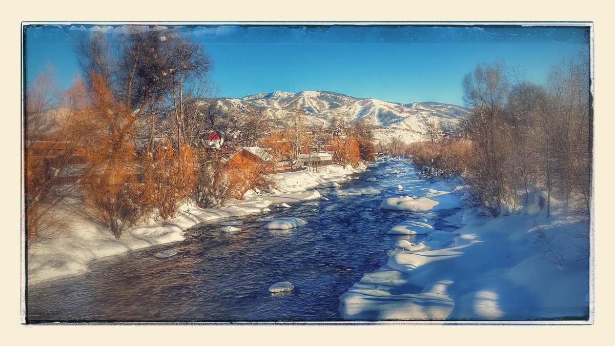 Snowy Riverbank Golden Morning Light With Reflections Capture.jpg