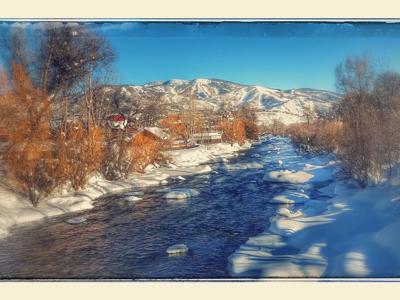 Snowy Riverbank Golden Morning Light With Reflections Capture.jpg