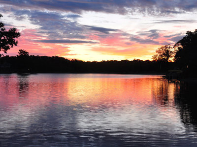 Vibrant Magnificent Sunset Glassy Lake Glassy Water Reflection Quiet Evening.jpg