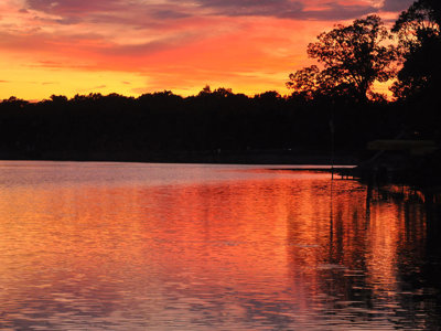 Vibrant Magnificent Sunset Reflections Over Calm Lake Calm Water Dreamy Evening.jpg